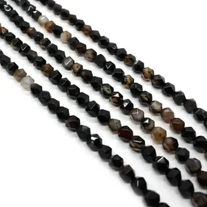 Macro shot of faceted black agate beads with reflective surfaces for DIY jewelry