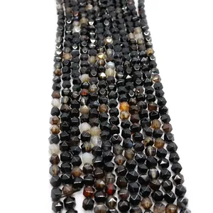 Macro view of faceted black onyx gemstone beads with natural textures for DIY jewelry