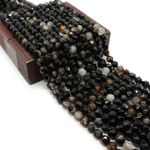 Macro detail of faceted black striped agate beads for DIY jewelry making accessories