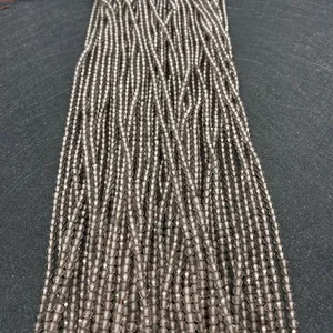 Macro detail of faceted smoky quartz beads showing vertical strands for jewelry DIY
