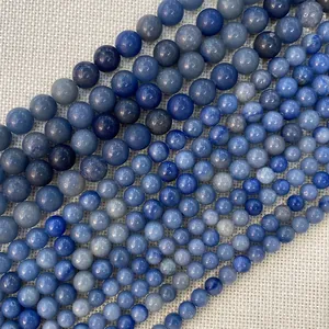 Macro shot of assorted blue natural stone round beads for DIY jewelry making