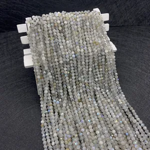 Macro shot of 3mm faceted natural labradorite beads with blue flash and yellow shimmer
