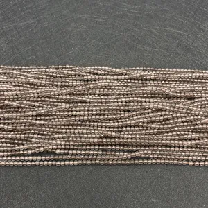 Detailed macro view of 2-4mm faceted smoky quartz beads for DIY jewelry making