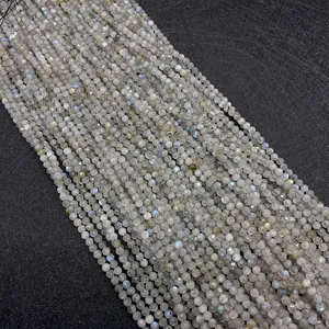 Macro shot of faceted labradorite gemstone beads showing blue flashes for DIY jewelry