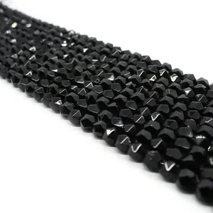 Macro shot of polished black onyx faceted beads for DIY jewelry and necklaces