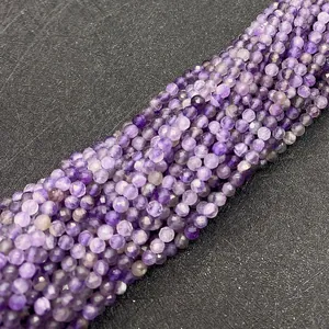 Macro shot of 2mm faceted natural amethyst round beads for DIY jewelry making