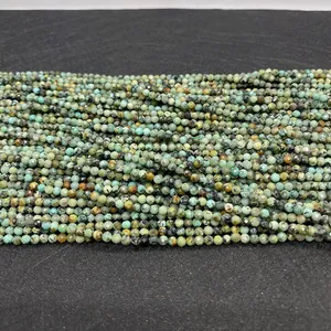 Macro shot of faceted 2mm African Jasper round beads with natural blue-green mineral textures