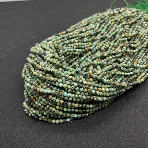 Macro shot of 2mm faceted African turquoise gemstone beads showing natural patterns