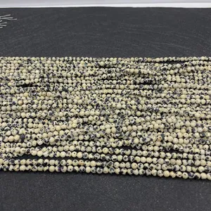 Close-up of faceted dalmatian jasper stone beads for DIY jewelry making