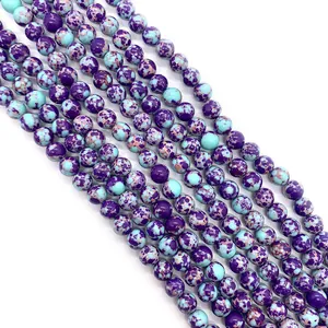 Macro detail of marbled purple and turquoise stone beads for DIY jewelry making