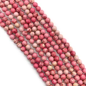 Macro view of pink imperial jasper beads with natural marble texture for DIY jewelry