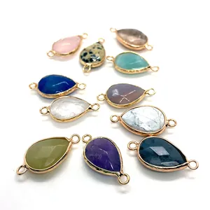 Faceted teardrop gemstone connectors in multiple colors with gold plated metal rims