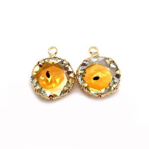 Natural yellow stone pendants with gold crown edges and faceted crystal details