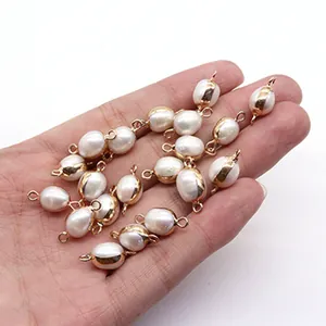 Macro shot of natural freshwater rice pearls with gold-plated trim for DIY jewelry