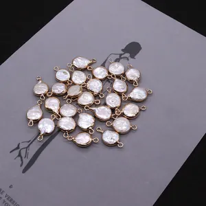 Detailed macro view of natural freshwater shell pendants with gold-plated edges for DIY jewelry