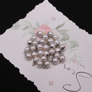 Macro view of natural freshwater pearl oval pendants with silver plating connectors