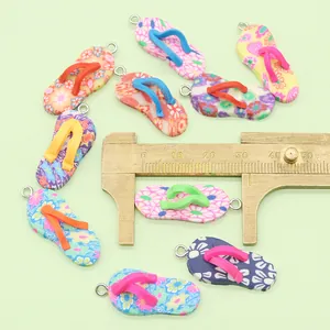 Detailed macro of colorful floral flip-flop charms made of polymer clay for DIY jewelry
