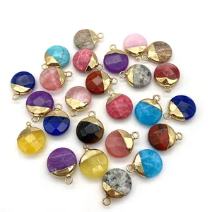 Set of multifaceted natural stone pendants in various colors with golden metal loops