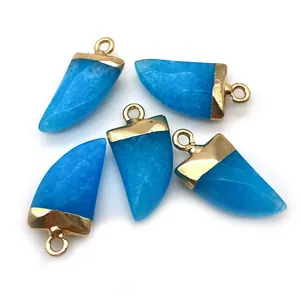 Detailed view of 5 faceted sky blue stone pendants with gold-plated caps for DIY jewelry