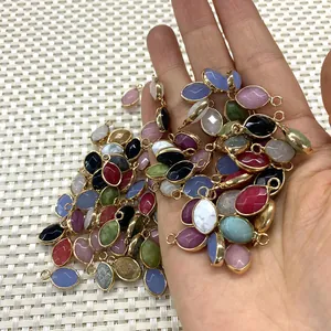 Faceted natural stone pendants in marquise shape with gold metal bezel plating