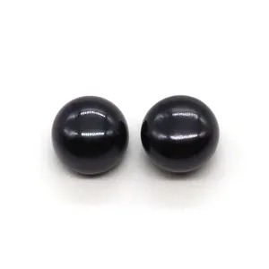 Macro shot of two high-luster black freshwater pearls for earring jewelry DIY accessories