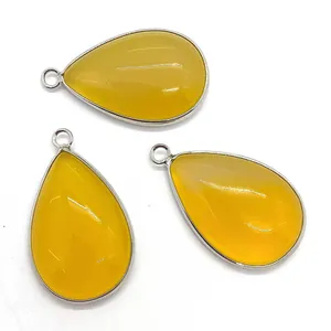 Three teardrop-shaped yellow natural stone pendants with silver metal edging for DIY jewelry