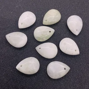 Close-up of nine light green pear-shaped natural stone beads with top-drilled holes