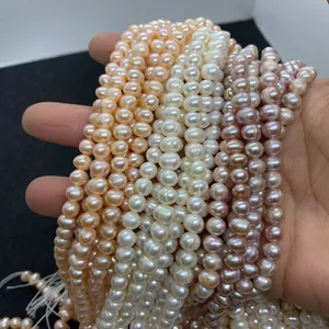 Detail of colorful 4-8mm natural freshwater pearls in pink white and purple for DIY