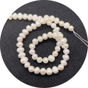 Natural freshwater pearls strand in potato shape for DIY jewelry making on black background
