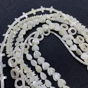 Natural white shell beads in cross star and fish shapes for DIY jewelry making