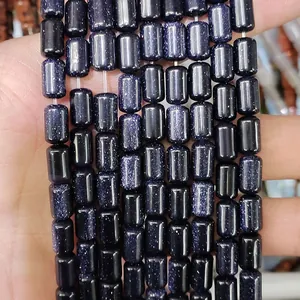 Detailed view of dark blue cylindrical blue goldstone spacer beads for DIY jewelry