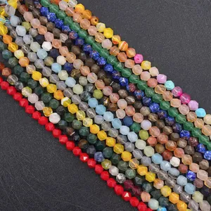 Close-up of faceted natural gemstone beads in agate, lapis, and tiger eye for DIY jewelry