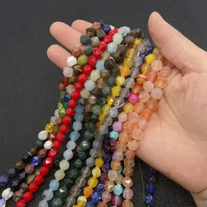 Close-up of faceted natural agate beads with geometric cut and diverse vivid colors