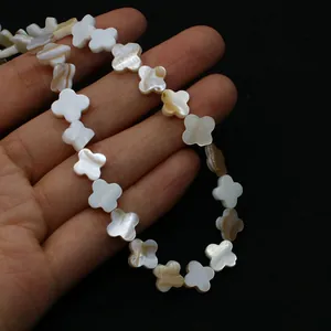 Macro shot of natural mother of pearl clover beads for DIY jewelry making