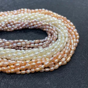 Detailed macro view of rice-shaped natural freshwater pearls in white pink and purple colors