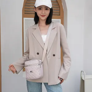 Pink quilted crossbody bag with embroidery and adjustable wide strap for women