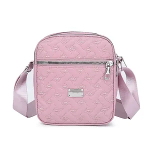 Pink crossbody square bag with heart embroidery and adjustable woven shoulder strap