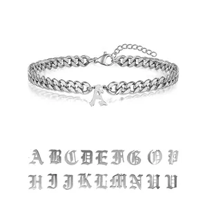 Detail of silver stainless steel Cuban link chain with Gothic initial letter pendants