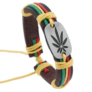 Detail of woven leather bracelet featuring colorful cords and metal leaf emblem