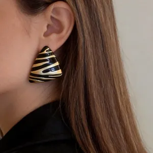 Vintage gold and black enamel triangle earrings with zebra stripe pattern for women