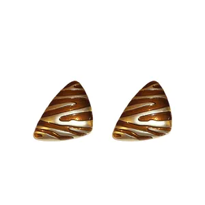 Retro triangle earrings with gold and silver wave stripes in a minimalist vintage style
