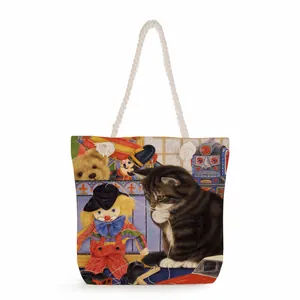 Close-up of thick cotton rope handles and vintage toy pattern on the canvas tote bag