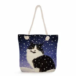 Detail of nautical rope handles on floral cat tote bag with snowy night art print