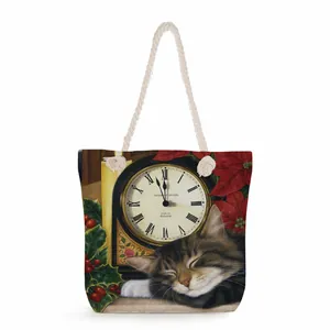 Detailed view of canvas tote bag featuring vintage cat clock print and white rope handles