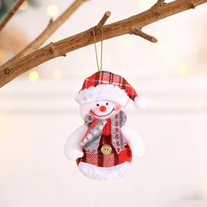 Close-up of a handmade snowman Christmas ornament with red plaid hat and scarf