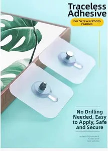 Detail of transparent self-adhesive wall screws and hooks for drill-free mounting