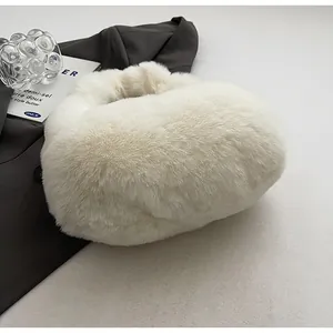 Close-up of soft white faux fur plush handbag texture with fluffy cloud shape design