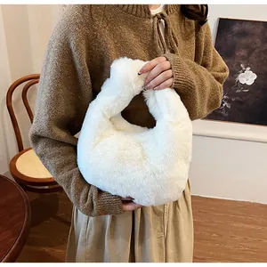 Detailed view of fluffy white faux fur handbag texture in a cozy lifestyle setting