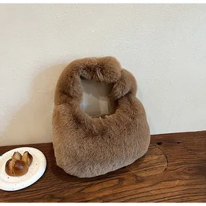 Close-up of fluffy dark brown plush handbag with dense faux fur texture on wooden table