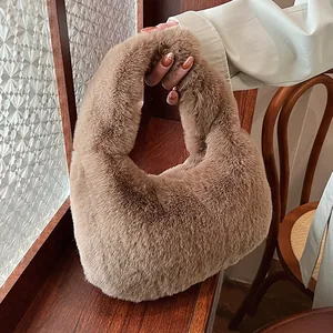 Brown faux fur dumpling handbag for women with soft plush texture and top handle